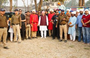Devotees carry 94-foot-tall new Flagpole to Guru Ram Rai Darbar