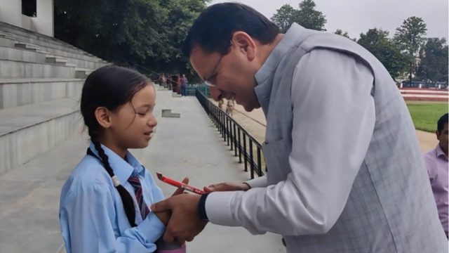 Dhami interacts with schoolgirl at helipad in Doon